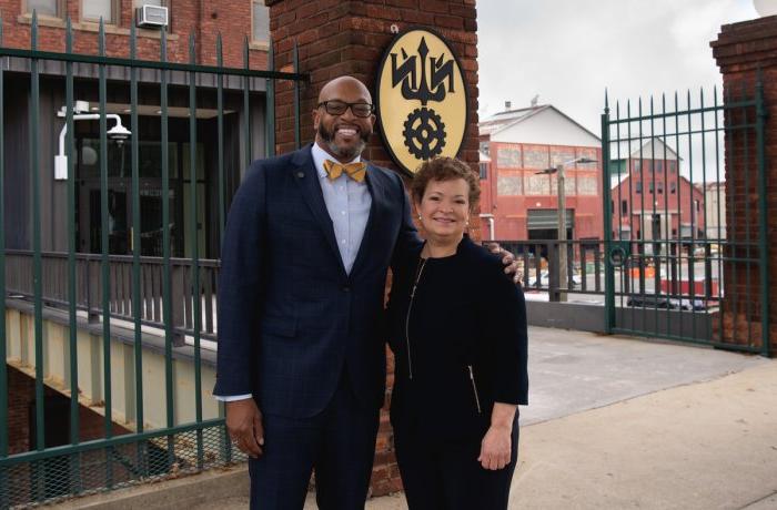 Photo of a man and a woman standing together.